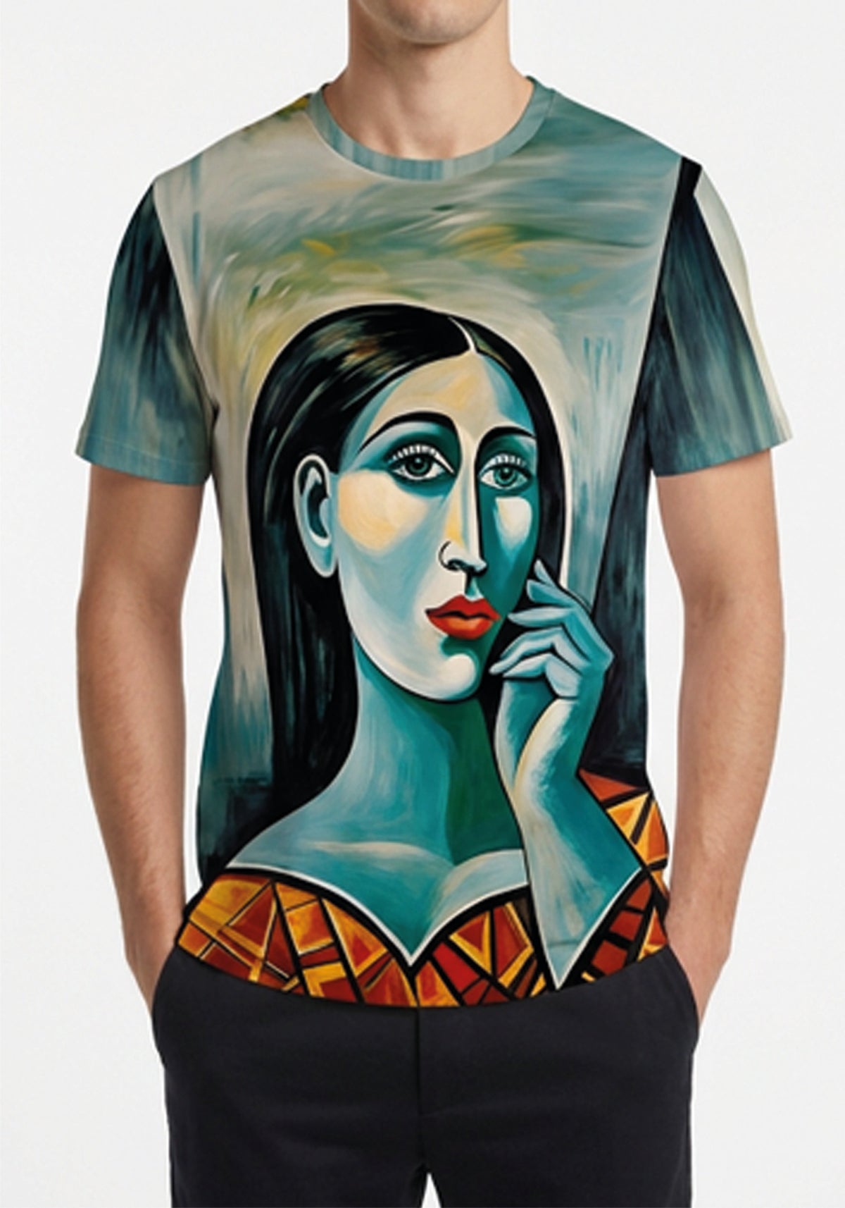 A man wearing a short-sleeve crewneck t-shirt featuring a stylized, colorful portrait of a woman with blue skin tones, black hair, and red lips, set against a teal and yellow background